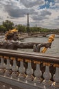Golden statue on bridge at Seine River and Eiffel Tower in Paris